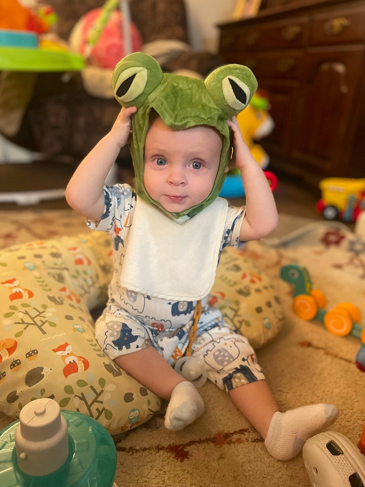 Jaiden joined the competition — help win amazing prizes! baby, baby_toddler_clothing, child, event, fun, green, happy, headwear, leisure, party, pattern, person, personal_protective_equipment, play, room, shorts, sitting, skin, sock, toddler