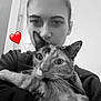 Gaia a rejoint le concours — aidez-le/la à gagner de superbes lots ! black_and_white, cat, person, selfie, heart_emoji, indoor, close_up, pet, holding, face, animal, feline, cute, affection, casual, young_adult, expression, hair_bun, whiskers, portrait
