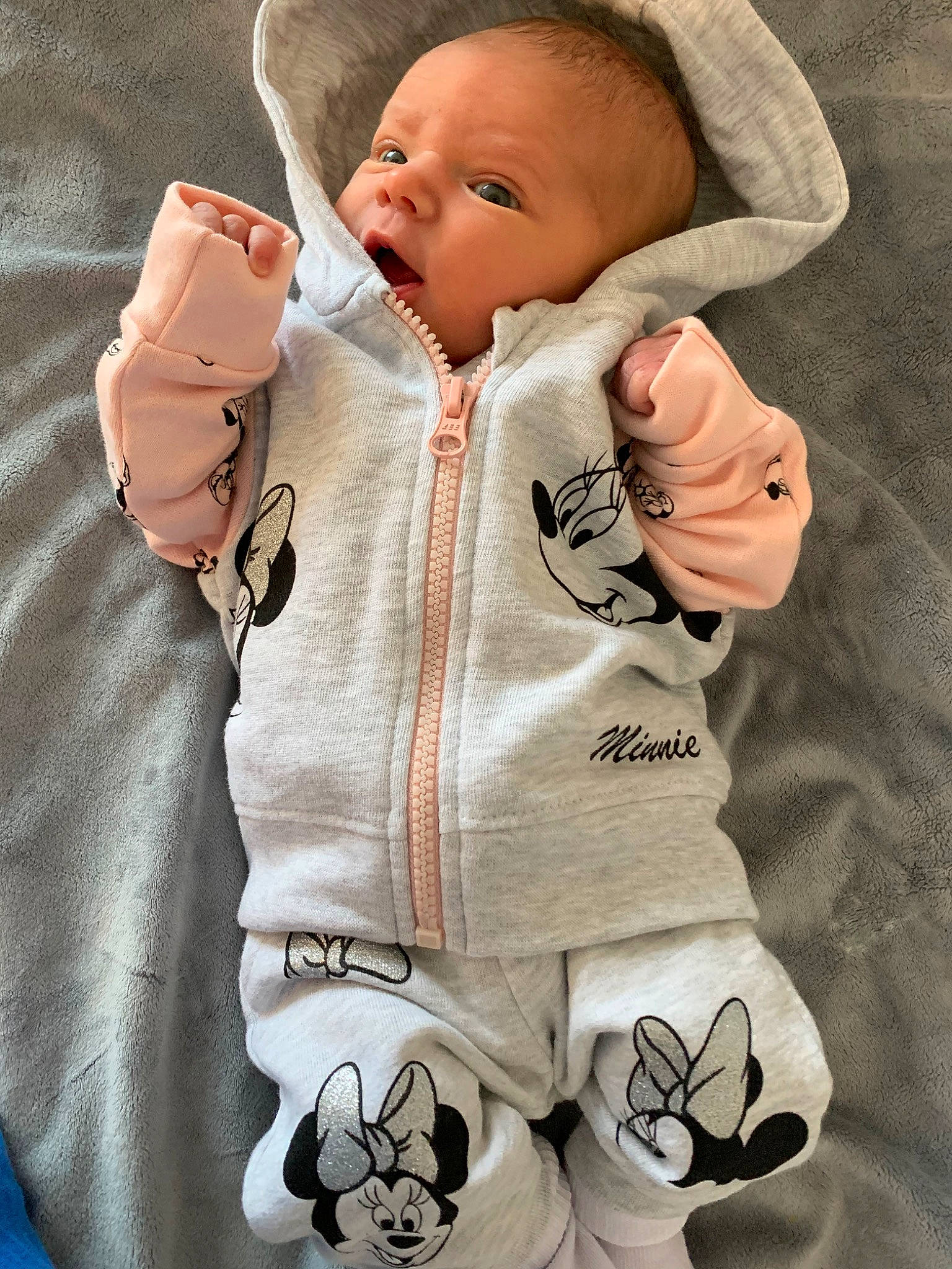 Lexie is registered to the contest to win money with this photo: baby, baby_products, baby_toddler_clothing, cheek, child, gesture, hoodie, outerwear, person, product, sleeve, toddler