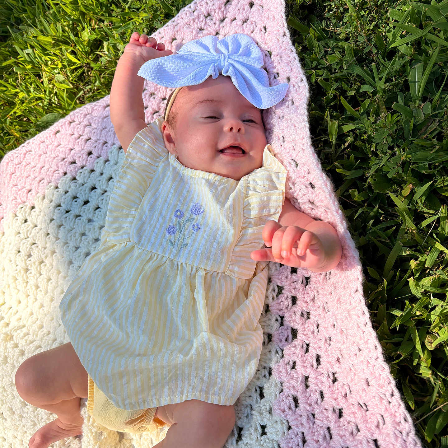 Paisley joined the competition — help win amazing prizes! baby, child, infant, grass, blanket, crochet, headband, bow, dress, yellow, pink, white, outdoor, sunlight, smiling, happy, reaching, skin, legs, hands