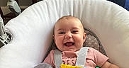 Paisley joined the competition — help win amazing prizes! baby, baby_chair, book, child, colorful, cushion, cute, fabric, happy, home, indoors, infant, person, pink_clothing, play, seat, smiling, toy, window, young_child