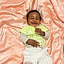Kayla participe au concours pour gagner de l'argent avec cette photo : baby, child, smiling, laughing, clothing, striped_pants, green_shirt, long_sleeves, fabric, silky, peach_color, lying_down, happy, infant, cute, portrait, indoors, soft_texture, cheerful, person