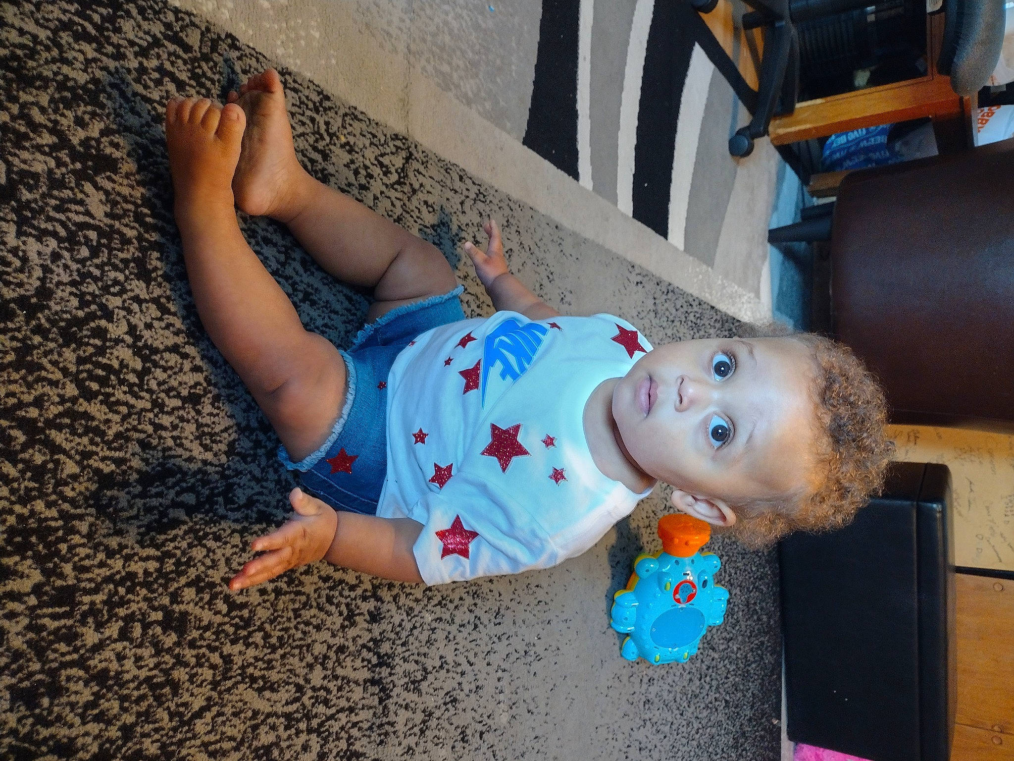 Zariyah joined the competition — help win amazing prizes! baby_toddler_clothing, child, denim, elbow, electric_blue, flooring, fun, hand, happy, human_body, human_leg, joint, leg, leisure, person, surprise, t_shirt, textile, thigh, toddler