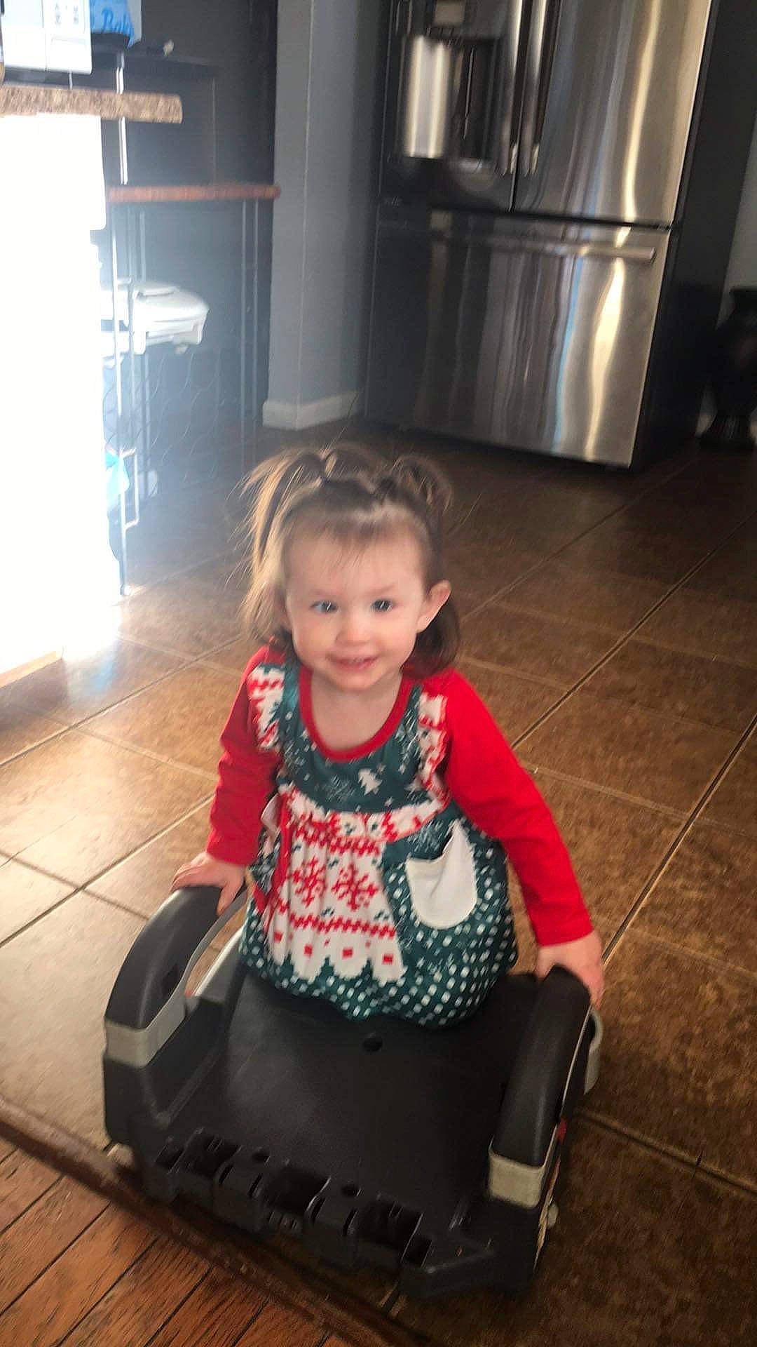 Nylah joined the competition — help win amazing prizes! baby_toddler_clothing, child, fashion_accessory, floor, flooring, fun, gas, happy, joint, joy, magenta, pattern, person, room, sitting, sleeve, smile, snapshot, standing, tints_and_shades