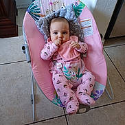 Lia Vana joined the competition — help win amazing prizes! baby, baby_seat, bib, bouncer, child, comfort, cute, face, floral_pattern, home, indoor, infant, looking, pajamas, person, pink, seated, thumb_sucking, tile_floor, young_child