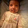 Ella is registered to the contest to win money with this photo: baby, babylaughing, bed, bedroom, clothing, coat, crib, dress, face, furniture, happy, head, indoors, infantbed, newborn, person, photography, portrait, room, smile