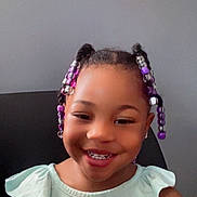 Dream is registered to the contest to win money with this photo: background, beads, braids, butterfly, chair, child, clothing, colorful, cute, face, fashion, girl, hair, happy, indoor, person, portrait, smile, top, young