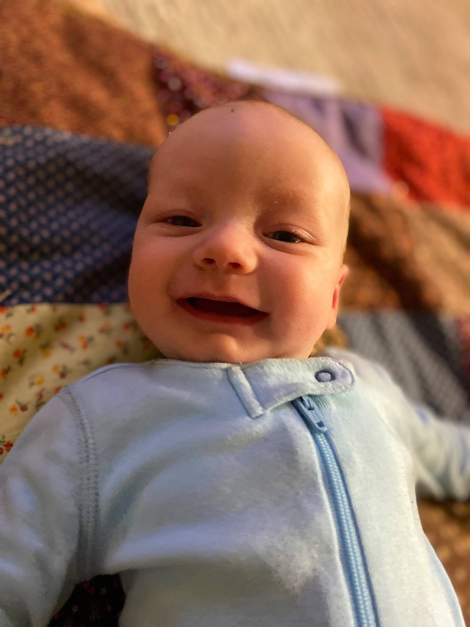 Augustus is registered to the contest to win money with this photo: baby, baby_toddler_clothing, cheek, child, chin, close_up, eye, eyebrow, facial_expression, fun, happy, head, iris, lip, nose, person, skin, sleeve, smile, toddler