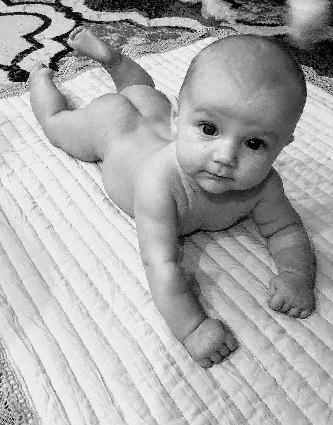 Leighton joined the competition — help win amazing prizes! baby, black_and_white, blanket, cheek, child, eye, face, linens, monochrome, muscle, person, photograph, photography, sibling, skin, smile, stomach, toddler