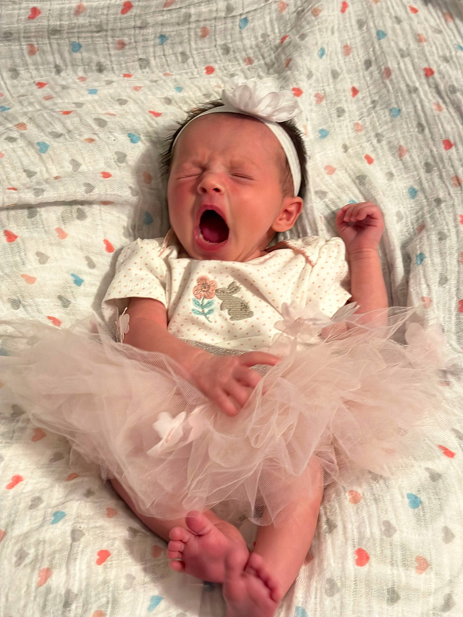 Elora is registered to the contest to win money with this photo: baby, baby_sleeping, baby_toddler_clothing, bedding, cheek, child, comfort, embellishment, hand, happy, linens, pattern, peach, person, pink, room, sitting, skin, sleeve, textile