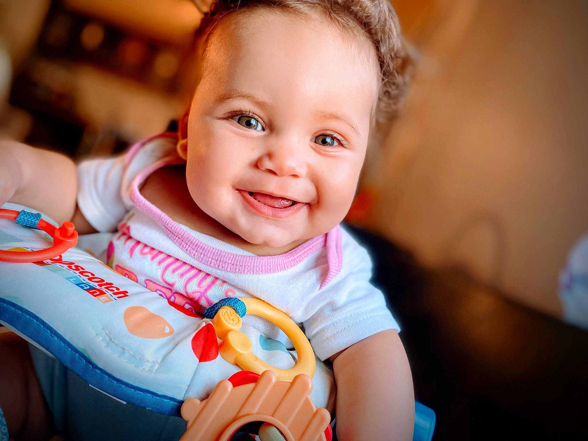 Cadence is registered to the contest to win money with this photo: baby, baby_products, baby_toddler_clothing, cheek, child, chin, eye, face, flash_photography, fun, happy, iris, joy, laugh, person, portrait_photography, sitting, skin, smile, t_shirt