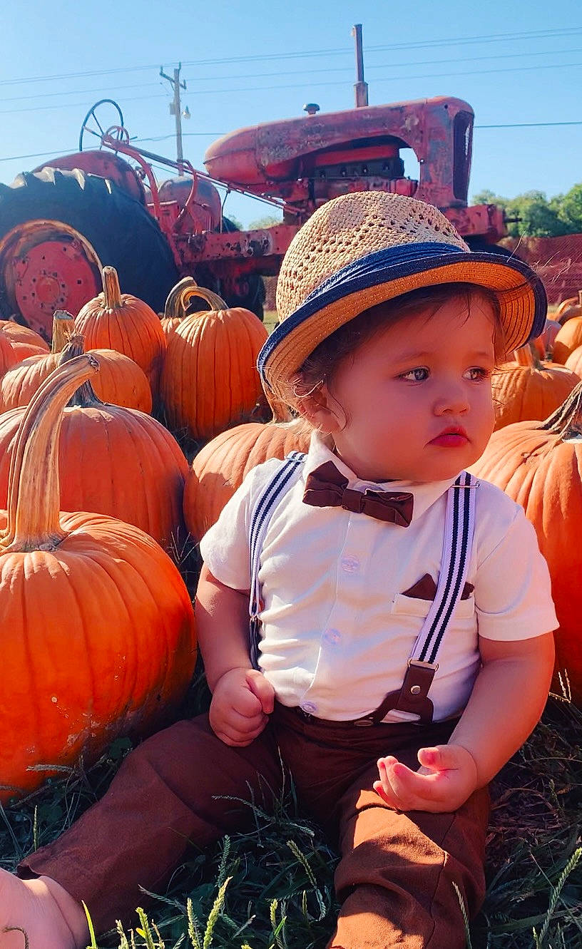 Callum joined the competition — help win amazing prizes! baby, calabaza, cucurbita, fun, gourd, grass, happy, hat, headwear, landscape, natural_foods, people_in_nature, person, plant, pumpkin, sitting, sky, squash, sun_hat, toddler
