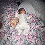 Austin joined the competition — help win amazing prizes! baby, sleeping, dog, bed, blanket, floral_pattern, onesie, pillow, indoor, pet, animal, cute, infant, rest, cozy, soft, companion, peaceful, home, child