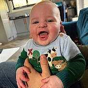 Colson joined the competition — help win amazing prizes! baby, casual, child, clothing, cute, face, fun, furniture, hand, happy, holding, home, indoor, infant, kitchen, person, portrait, smiling, sweater, window