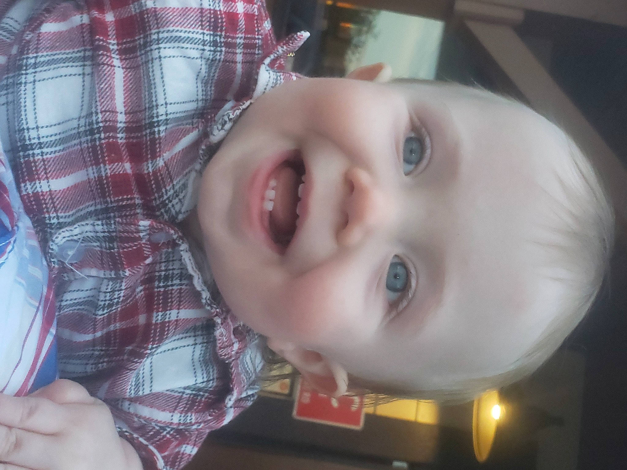 Daniel is registered to the contest to win money with this photo: baby, baby_toddler_clothing, cheek, child, chin, eyebrow, eyelash, forehead, iris, jaw, lip, mammal, mouth, nose, person, plaid, product, skin, smile, tartan