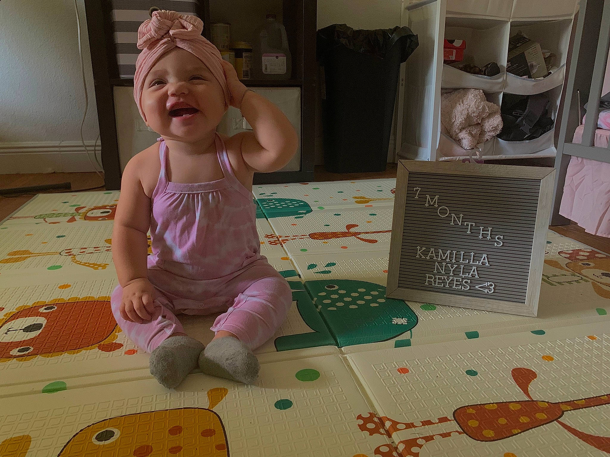 Kamilla joined the competition — help win amazing prizes! art, baby, baby_toddler_clothing, child, comfort, floor, flooring, foot, fun, headwear, linens, pattern, person, play, room, shelf, sitting, smile, toddler, toy