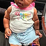 Skylah is registered to the contest to win money with this photo: baby, child, infant, portrait, sitting, car, passenger_seat, vehicle, bow, headband, denim_shorts, pink_shirt, striped_socks, fashion, cute, curious, facial_expression, indoor, social_media_screenshot, sticker