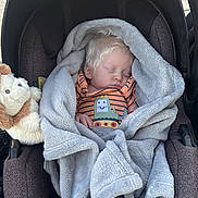 Roger joined the competition — help win amazing prizes! baby, sleeping, blanket, car_seat, stuffed_animal, outdoor, child, soft_texture, toddler, cozy, infant, cute, plush, clothing, face, peaceful, portrait, resting, toy, comfort