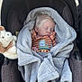 baby, sleeping, blanket, car_seat, stuffed_animal, outdoor, child, soft_texture, toddler, cozy, infant, cute, plush, clothing, face, peaceful, portrait, resting, toy, comfort