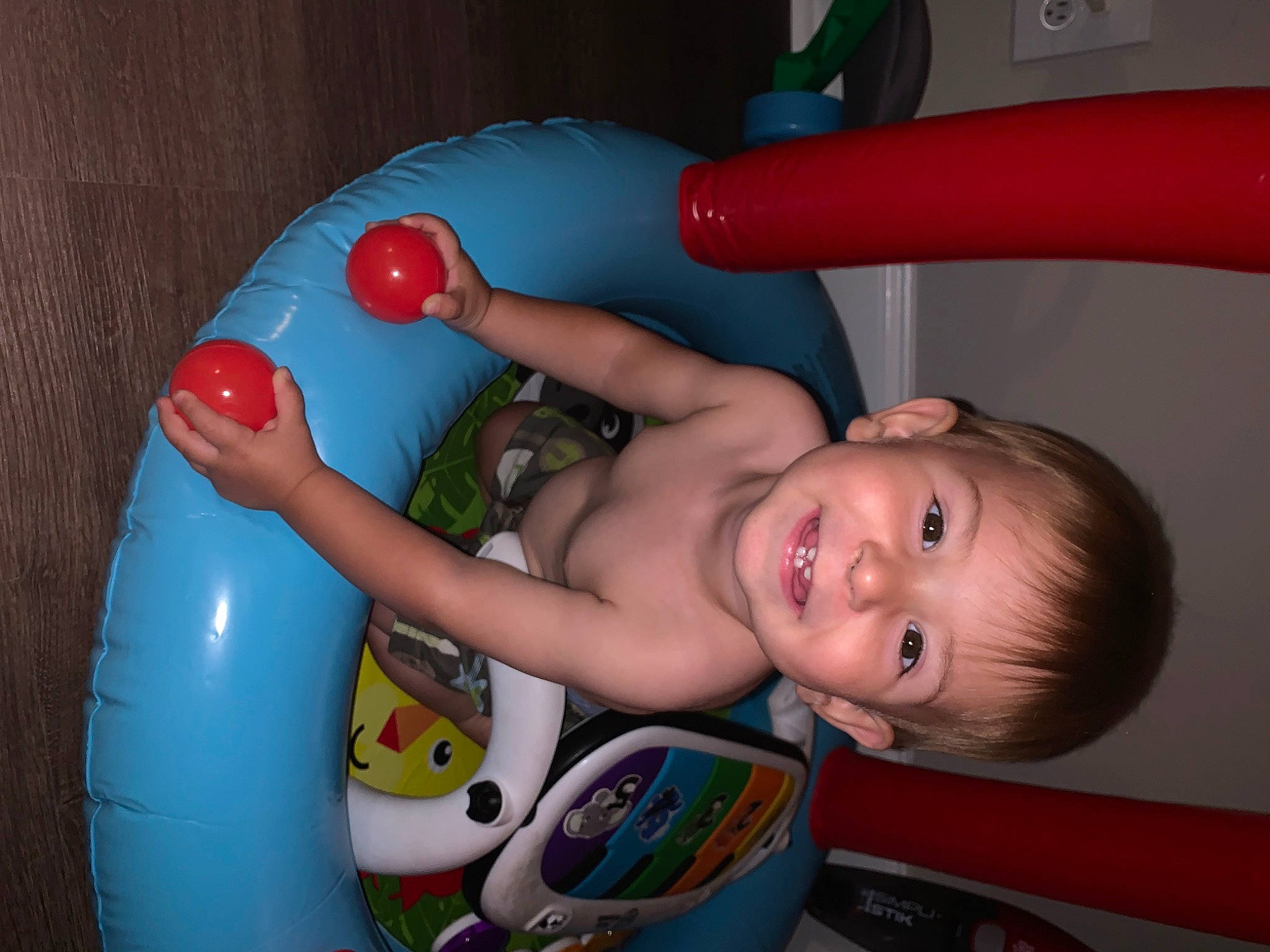 Adonis is registered to the contest to win money with this photo: arm, baby, baby_playing_with_toys, baby_products, bathing, chest, child, finger, fun, hand, happy, joy, mouth, organ, party_supply, person, plastic, product, skin, smile