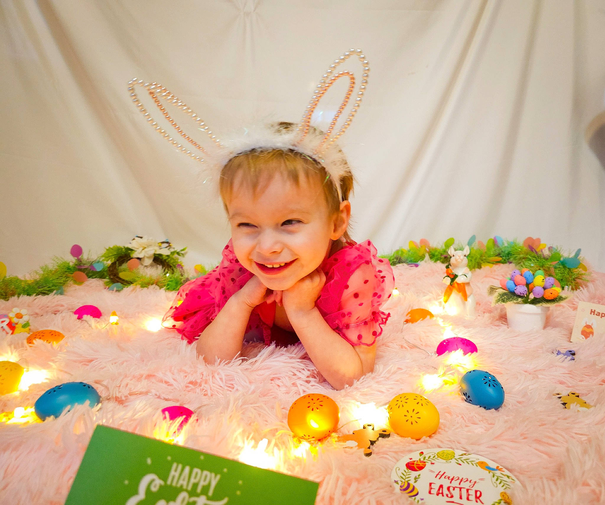 Hensley is registered to the contest to win money with this photo: baby, baby_toddler_clothing, birthday, birthday_party, child, event, fashion_accessory, fun, happy, headpiece, joy, magenta, orange, party, party_supply, peach, person, petal, pink, smile