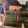 man, cat, barbecue, fire, grill, shorts, sunglasses, grass, house, stone_wall, fence, garden, sunset, outdoor, summer, footwear, path, backyard, animal, leisure