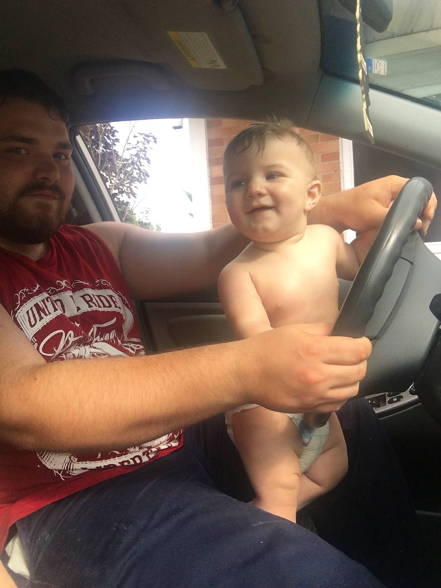 Eli joined the competition — help win amazing prizes! arm, car, car_seat, child, driving, family_car, muscle, person, smile, toddler, vacation, vehicle