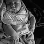 baby, sleeping, blanket, bib, infant, face, hand, black_and_white, soft, peaceful, newborn, cute, portrait, child, cozy, rest, closeup, clothing, babywear, comfort