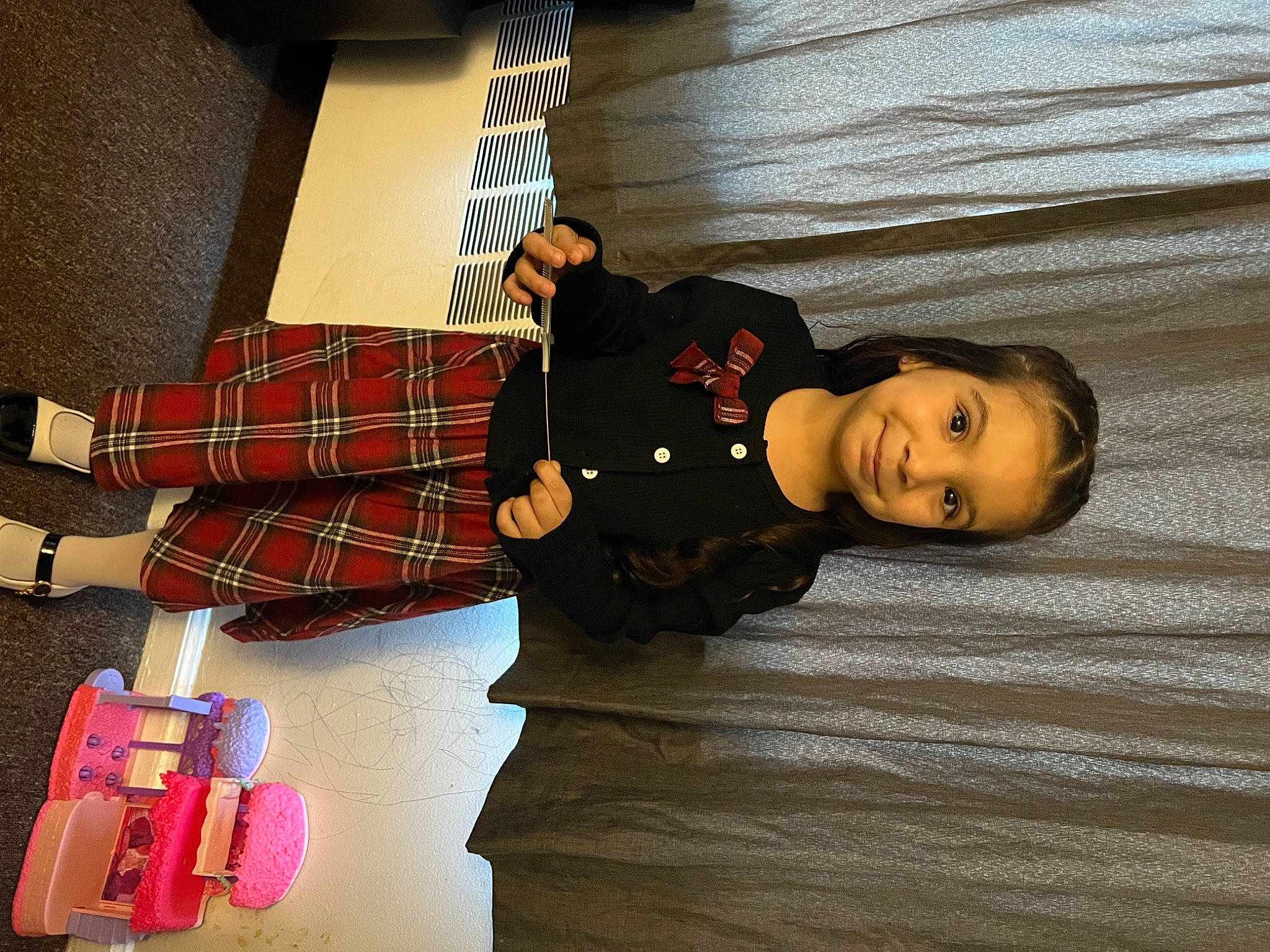 Emmy joined the competition — help win amazing prizes! carmine, child, flooring, fun, joy, luggage_and_bags, magenta, pattern, person, plaid, room, smile, sock, tartan, thigh, toddler, wood