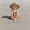 baby, barefoot, beach, child, cute, happy, hat, infant, nature, outdoor, playful, portrait, sand, shadow, sitting, smiling, summer, sunlight, sunny, vacation