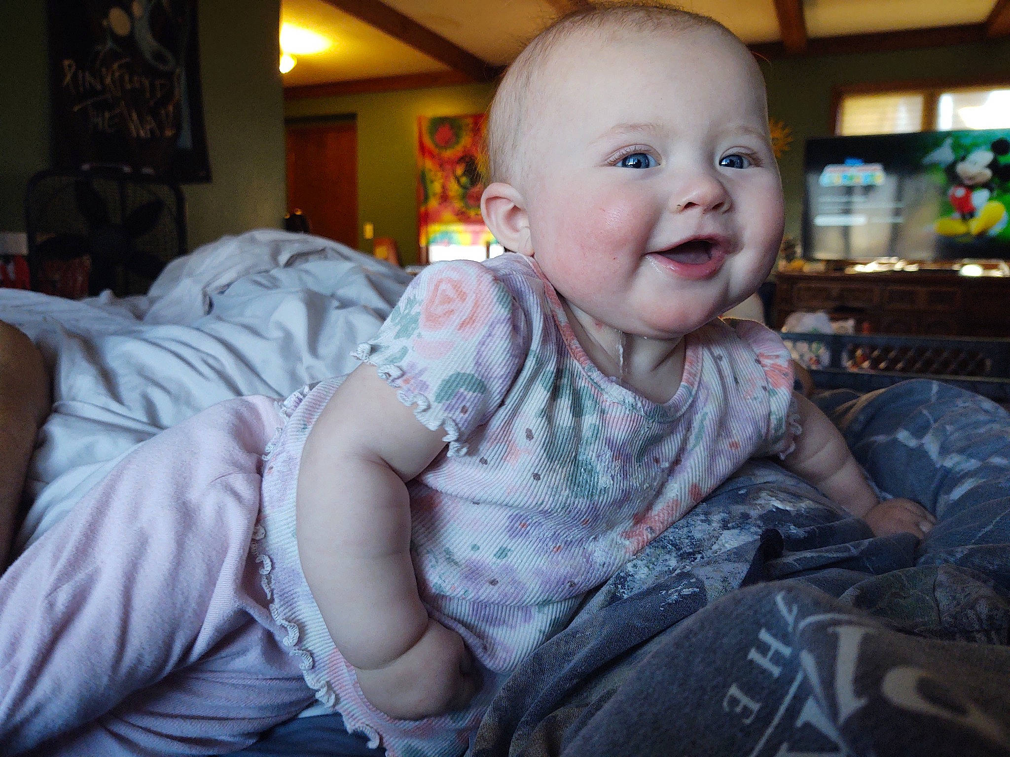 Althea is registered to the contest to win money with this photo: baby, baby_toddler_clothing, cheek, child, comfort, event, facial_expression, flash_photography, fun, happy, human, human_body, iris, mammal, mouth, person, pink, sitting, skin, smile