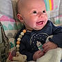 baby, smiling, infant, blanket, pacifier, beads, baby_seat, rainbow, sun, clothing, cute, happy, indoor, child, face, portrait, toy, comfort, warm, expression
