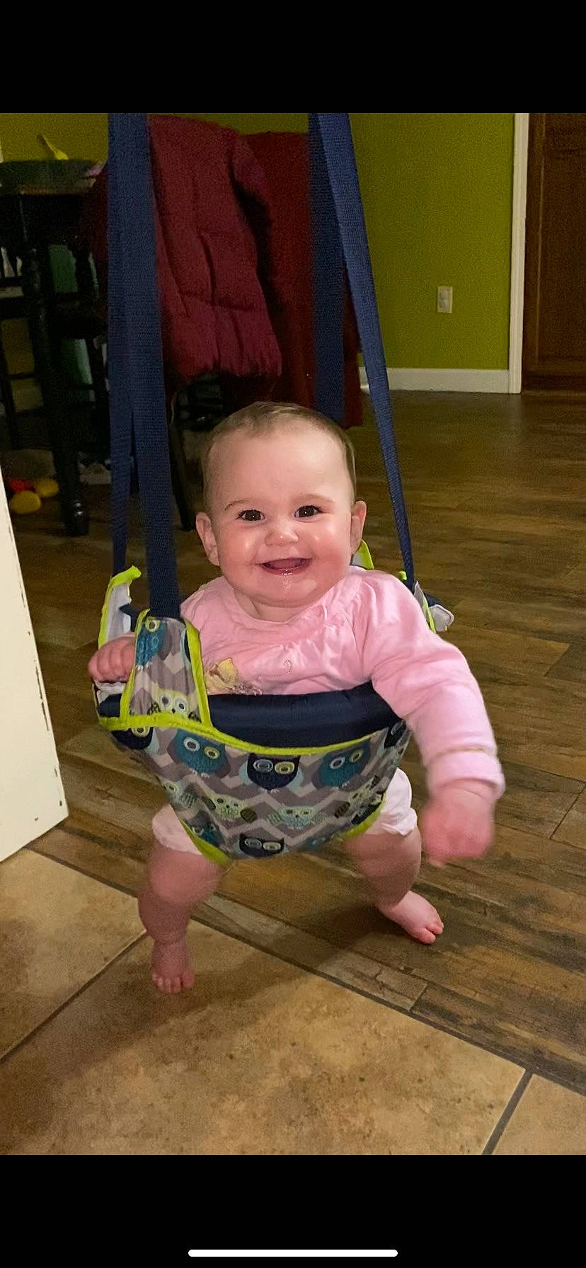 Riverlynn is registered to the contest to win money with this photo: baby, baby_toddler_clothing, barefoot, cheek, child, chin, eye, floor, flooring, foot, fun, happy, hardwood, joy, leisure, person, pink, skin, smile, t_shirt