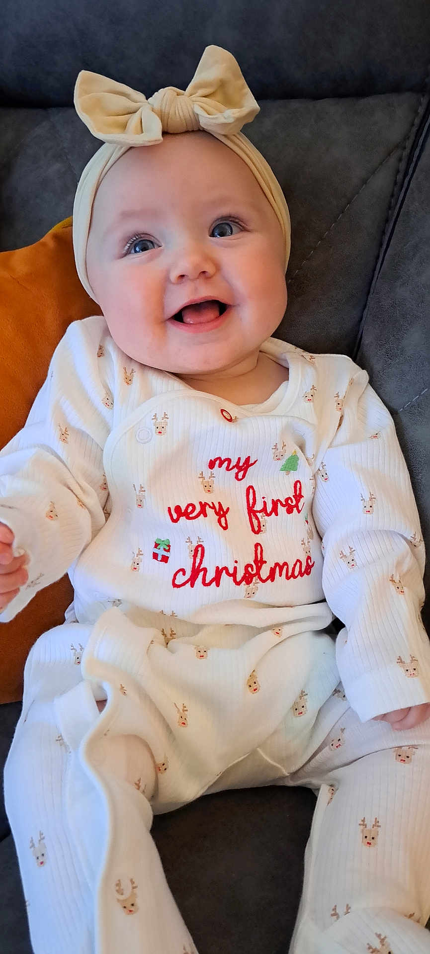 Remii joined the competition — help win amazing prizes! baby, child, smiling, headband, bow, pajamas, christmas, holiday, cute, infant, sitting, couch, pillow, white_clothing, face, happy, indoors, portrait, young_child, cozy