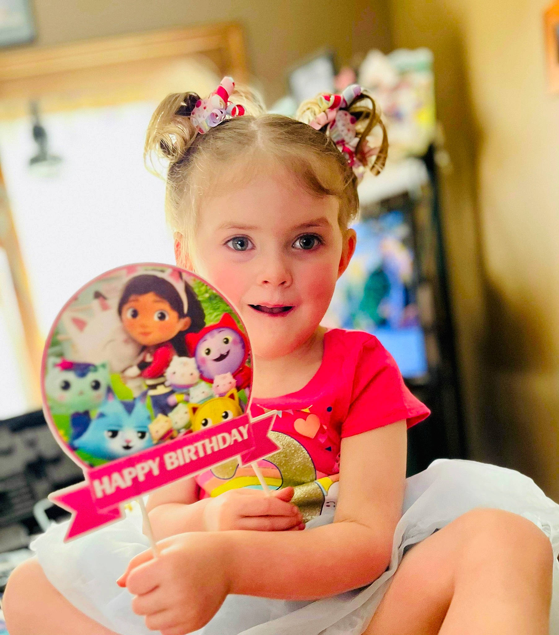 Xoey is registered to the contest to win money with this photo: baby, baby_playing_with_toys, baby_toddler_clothing, child, ear, event, eye, fashion_accessory, fun, hair_tie, happy, headband, person, pink, room, sitting, skin, smile, thigh, toddler