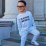 Asher joined the competition — help win amazing prizes! child, boy, glasses, sweatshirt, playdate_material, sneakers, nike, stairs, stone, posing, smile, outdoor, casual_clothing, steps, young_child, fashion, cool, confident, portrait, urban