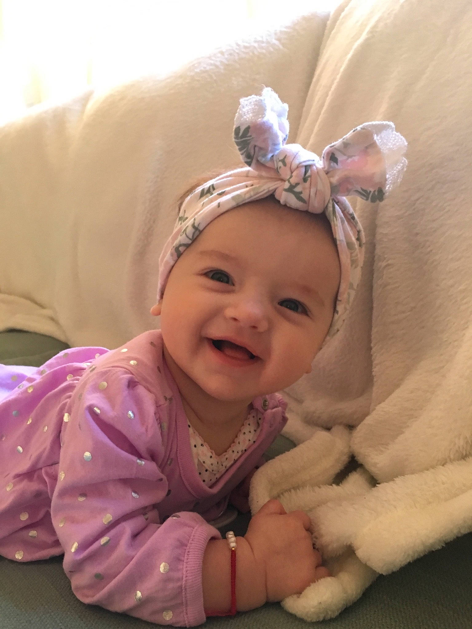 Kristina is registered to the contest to win money with this photo: cheek, child, ear, eye, fun, girl, hair_accessory, head, headband, headgear, headpiece, infant, iris, person, pink, product, purple, skin, smile, textile