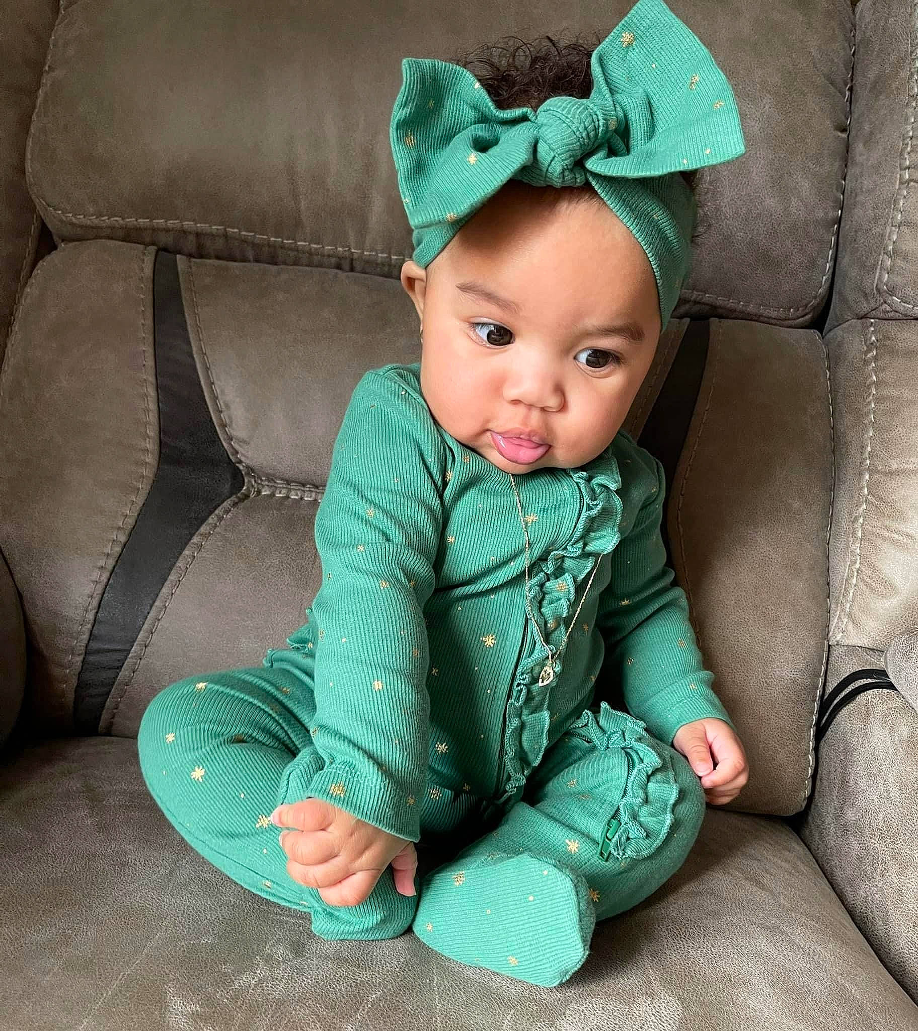 Mia is registered to the contest to win money with this photo: baby, baby_toddler_clothing, child, comfort, costume_hat, dress, electric_blue, eye, fashion_accessory, flash_photography, grass, green, hat, head, headband, human_body, person, sitting, skin, sleeve