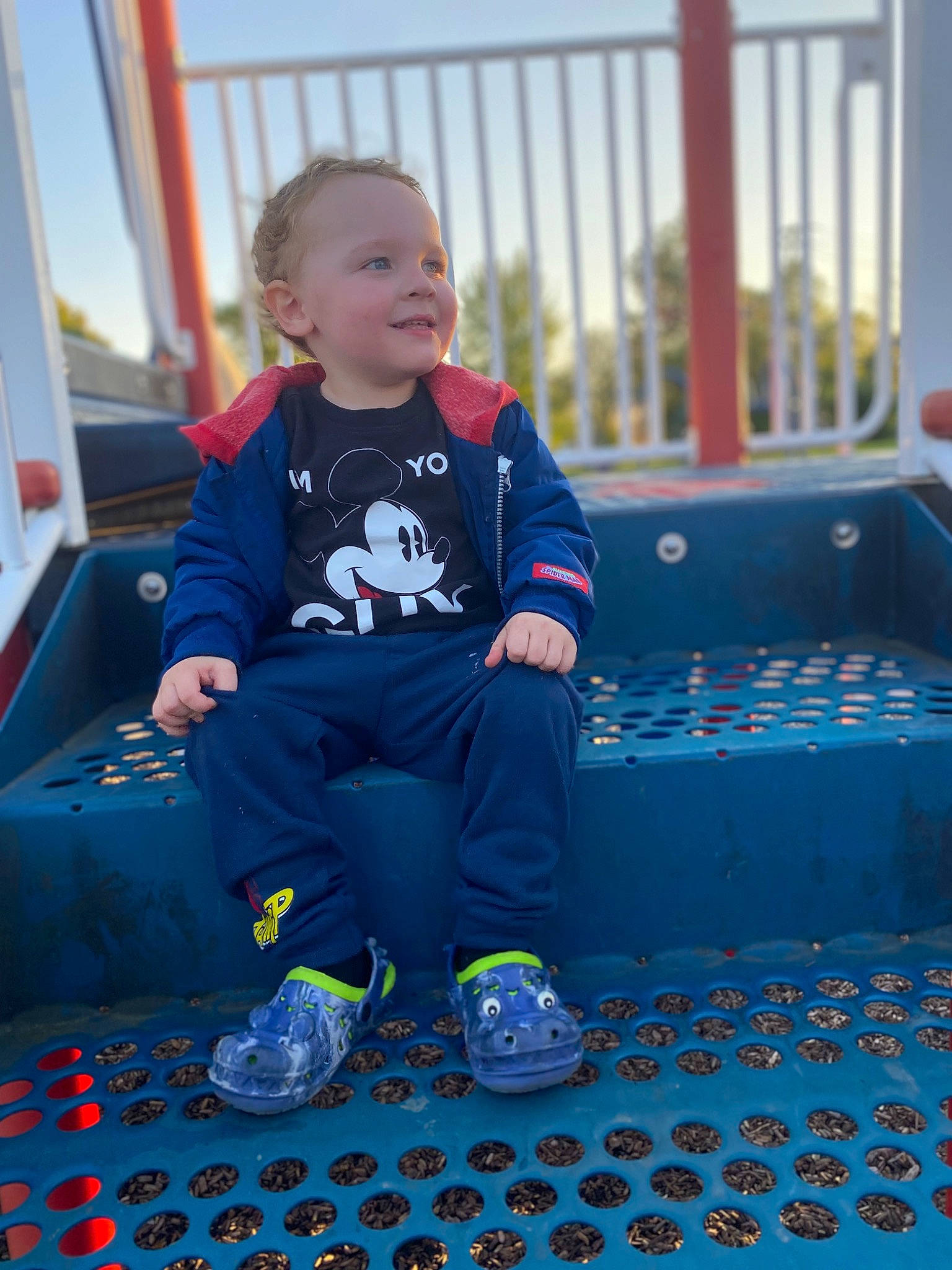 Leo is registered to the contest to win money with this photo: azure, baby_toddler_clothing, blue, child, electric_blue, flooring, fun, happy, joy, leisure, pattern, person, purple, recreation, sitting, sky, sleeve, smile, sneakers, t_shirt