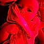 Novah-Seren is registered to the contest to win money with this photo: baby, child, face, hand, cloth, fabric, red_light, closeup, infant, portrait, skin, cute, eyes, soft_texture, indoors, newborn, wrapped, holding, person, young