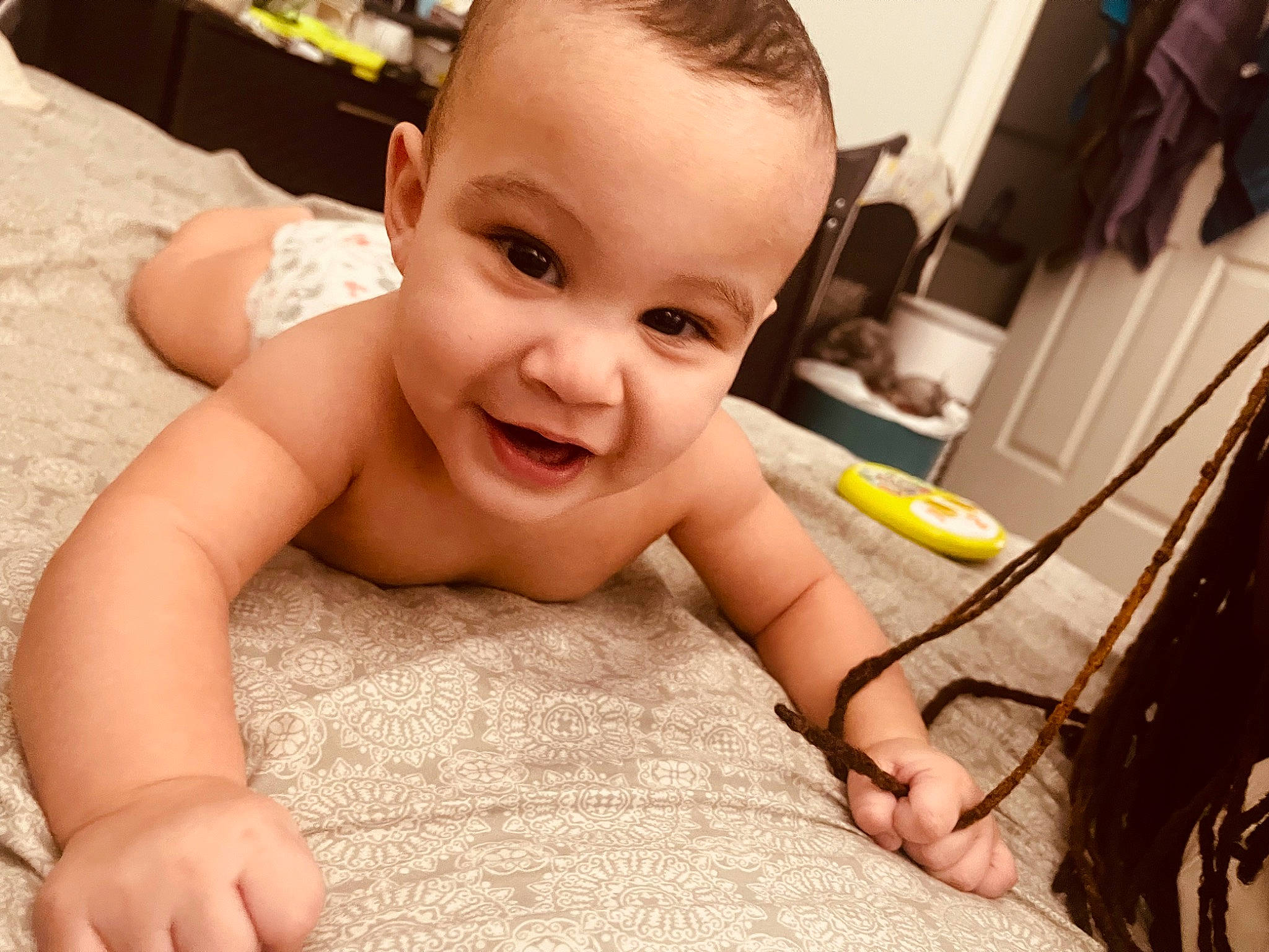 Denzel is registered to the contest to win money with this photo: baby, barechested, bathing, cheek, chest, child, eyebrow, eyelash, face, finger, flooring, happy, head, human_body, neck, nose, person, skin, smile, thigh