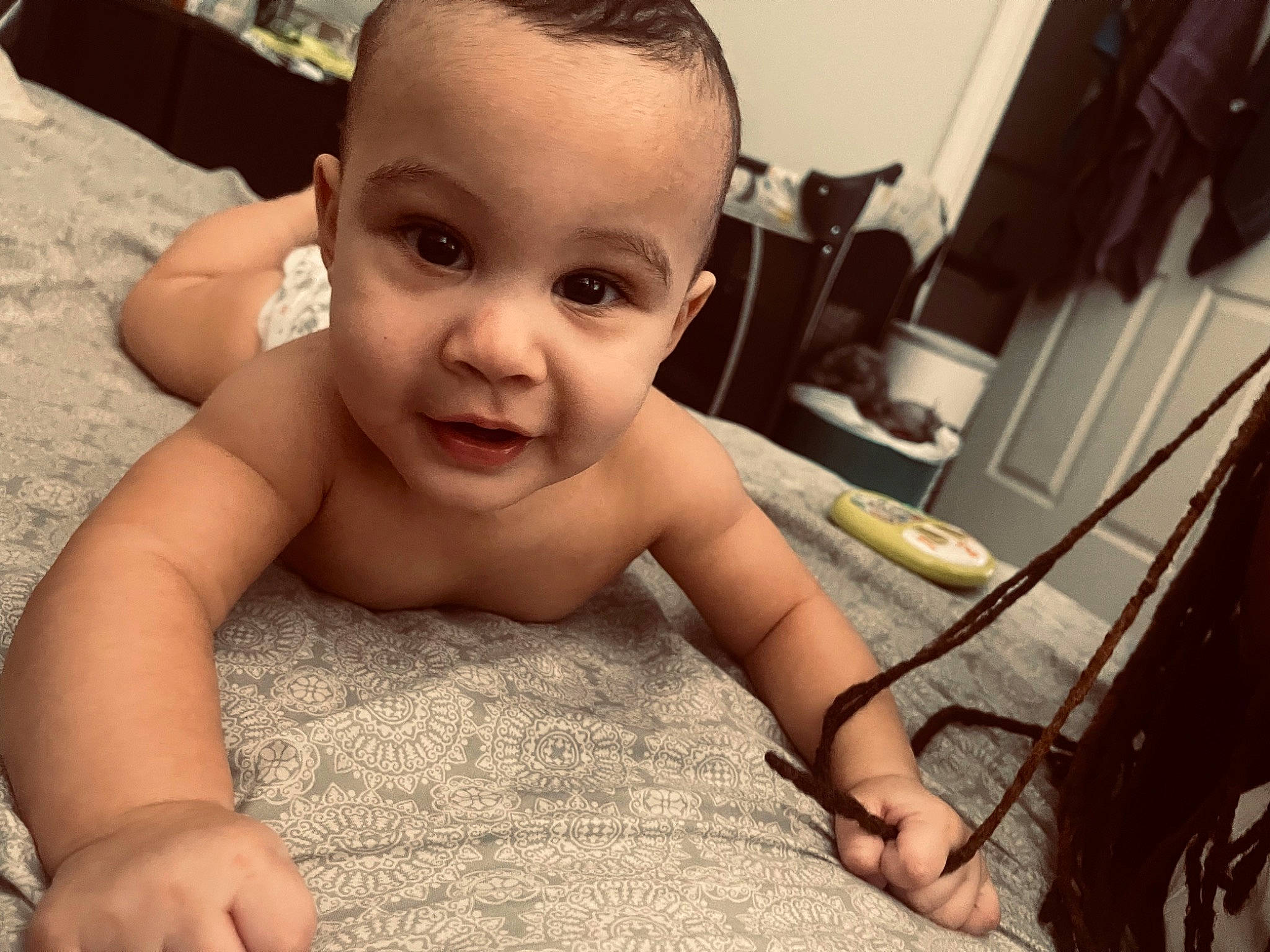 Denzel is registered to the contest to win money with this photo: baby, barechested, cheek, chest, child, comfort, eye, eyebrow, eyelash, flooring, fun, happy, human_body, iris, lip, nose, person, skin, thumb, toddler
