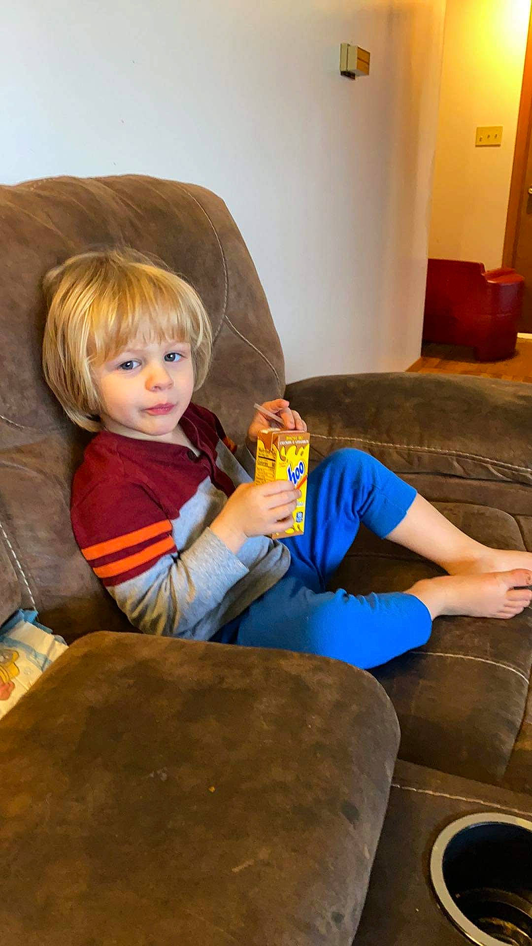 Benjiman joined the competition — help win amazing prizes! arm, blond, brown_hair, comfort, electric_blue, eye, facial_expression, floor, flooring, fun, human_body, human_leg, knee, lamp, lap, living_room, person, sitting, thigh, toddler