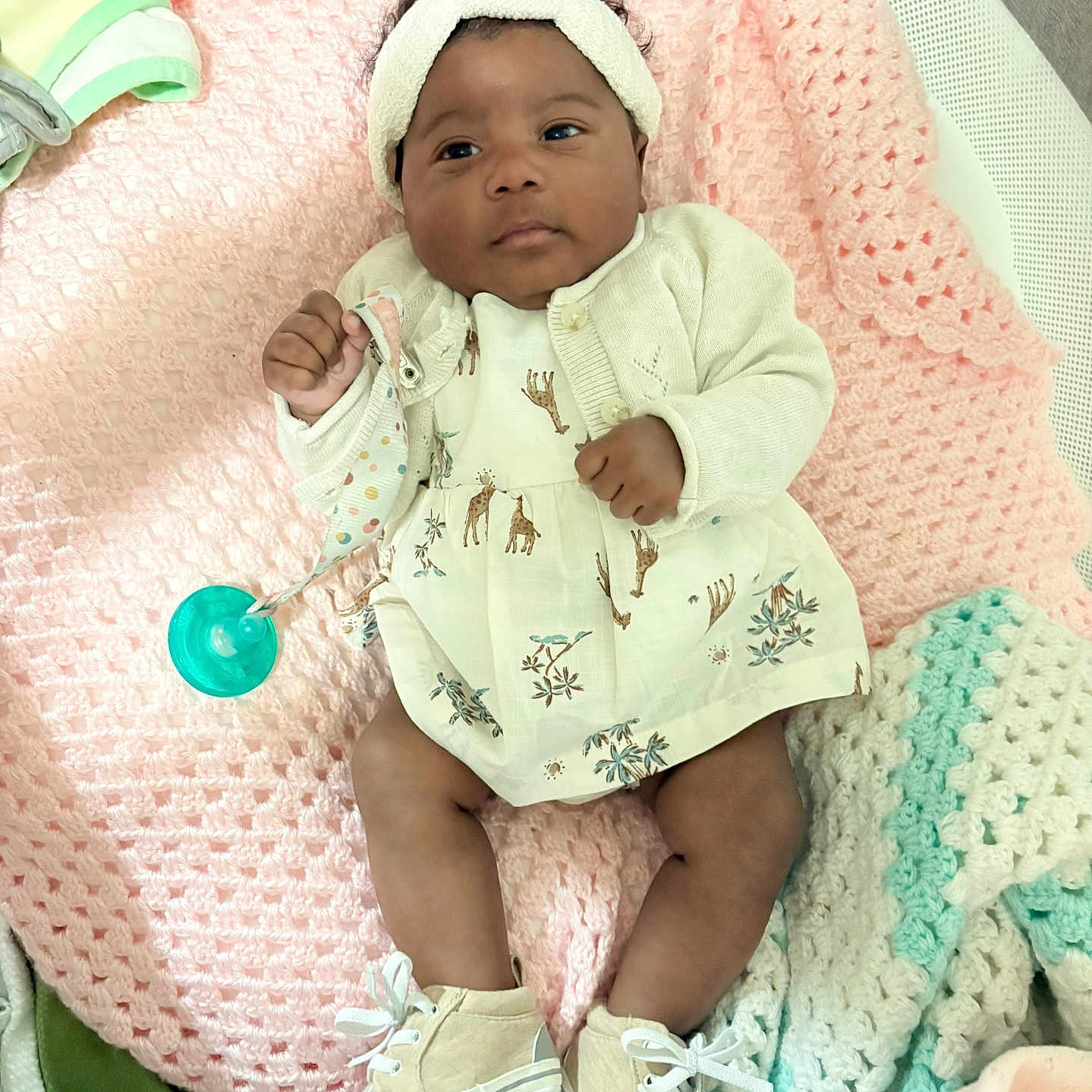 Dominique joined the competition — help win amazing prizes! baby, bed, blanket, bonnet, cap, clothing, couch, face, footwear, furniture, hat, head, homedecor, newborn, person, photography, portrait, quilt, shoe, sitting