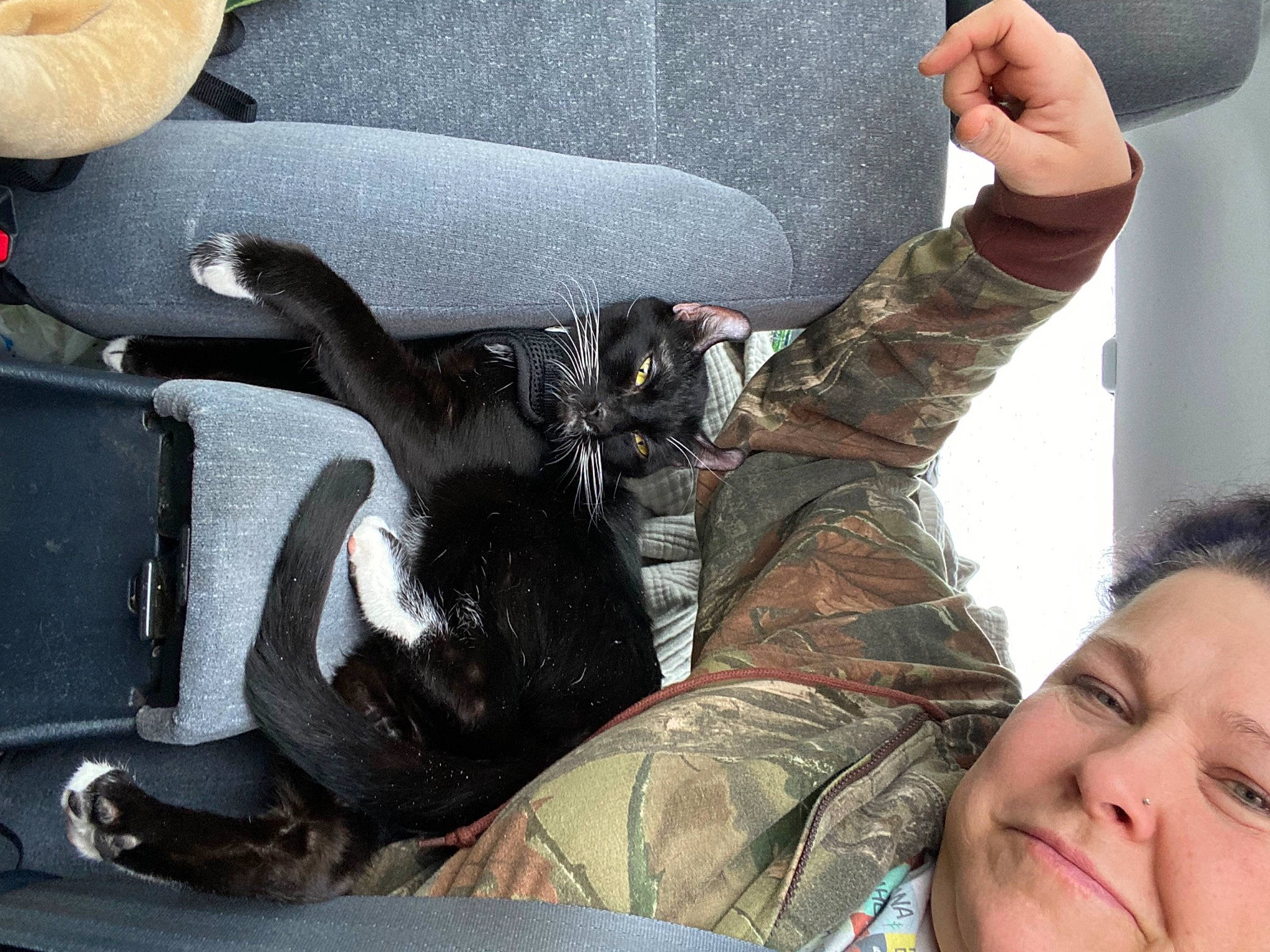 Charlotte is registered to the contest to win money with this photo: arm, auto_part, automotive_exterior, automotive_tire, black_hair, bumper, comfort, eyewear, finger, gesture, happy, human_body, human_leg, motor_vehicle, selfie, smile, travel, tree, vehicle_door, wrist