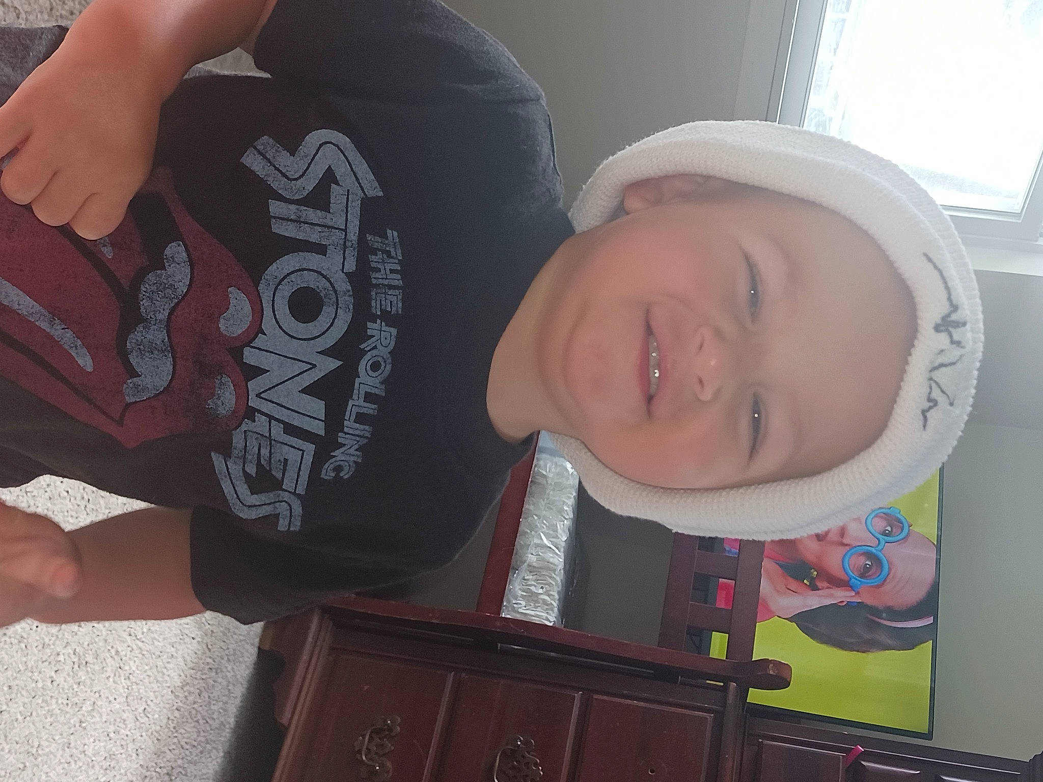 Aiden joined the competition — help win amazing prizes! cabinetry, child, chin, cool, design, elbow, fun, gesture, hairstyle, happy, headwear, mouth, neck, pattern, person, room, sleeve, smile, t_shirt, thumb