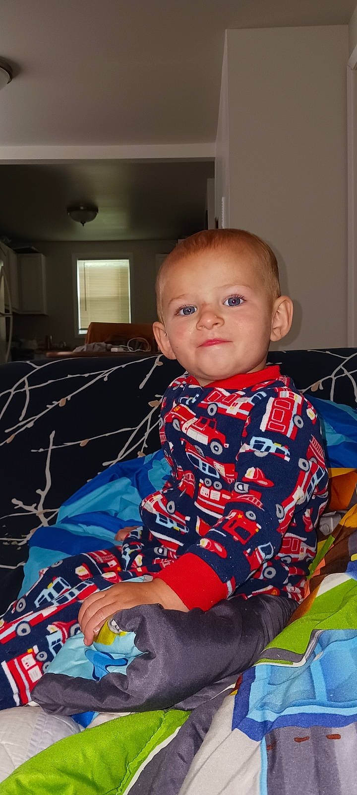 Aiden joined the competition — help win amazing prizes! baby, baby_toddler_clothing, cabinetry, chair, child, comfort, couch, event, fun, linens, pattern, person, plaid, play, room, sitting, sleeve, t_shirt, textile, toddler