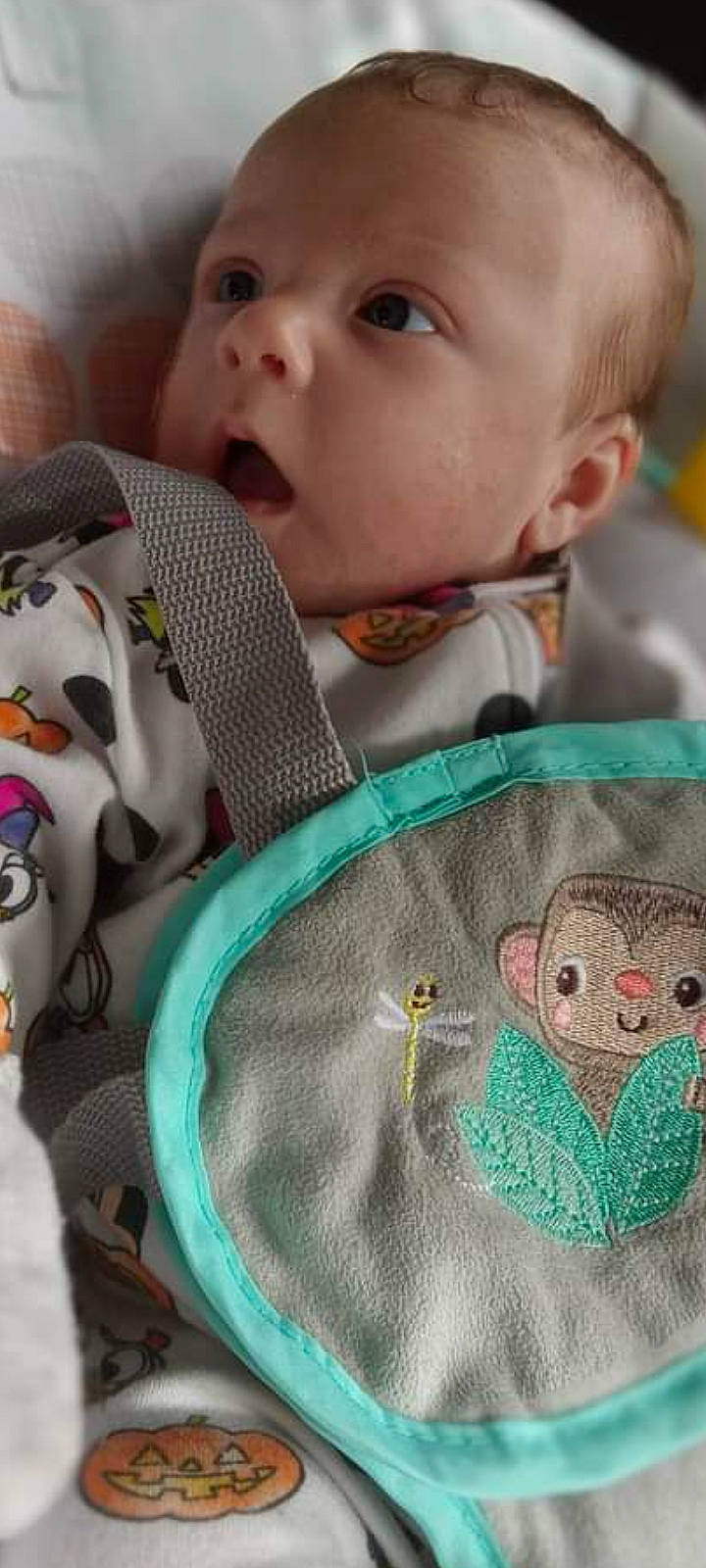 Hadley is registered to the contest to win money with this photo: art, baby, baby_toddler_clothing, cheek, child, chin, facial_expression, finger, green, happy, headgear, human, mouth, nose, organ, person, skin, sleeve, surprise, textile