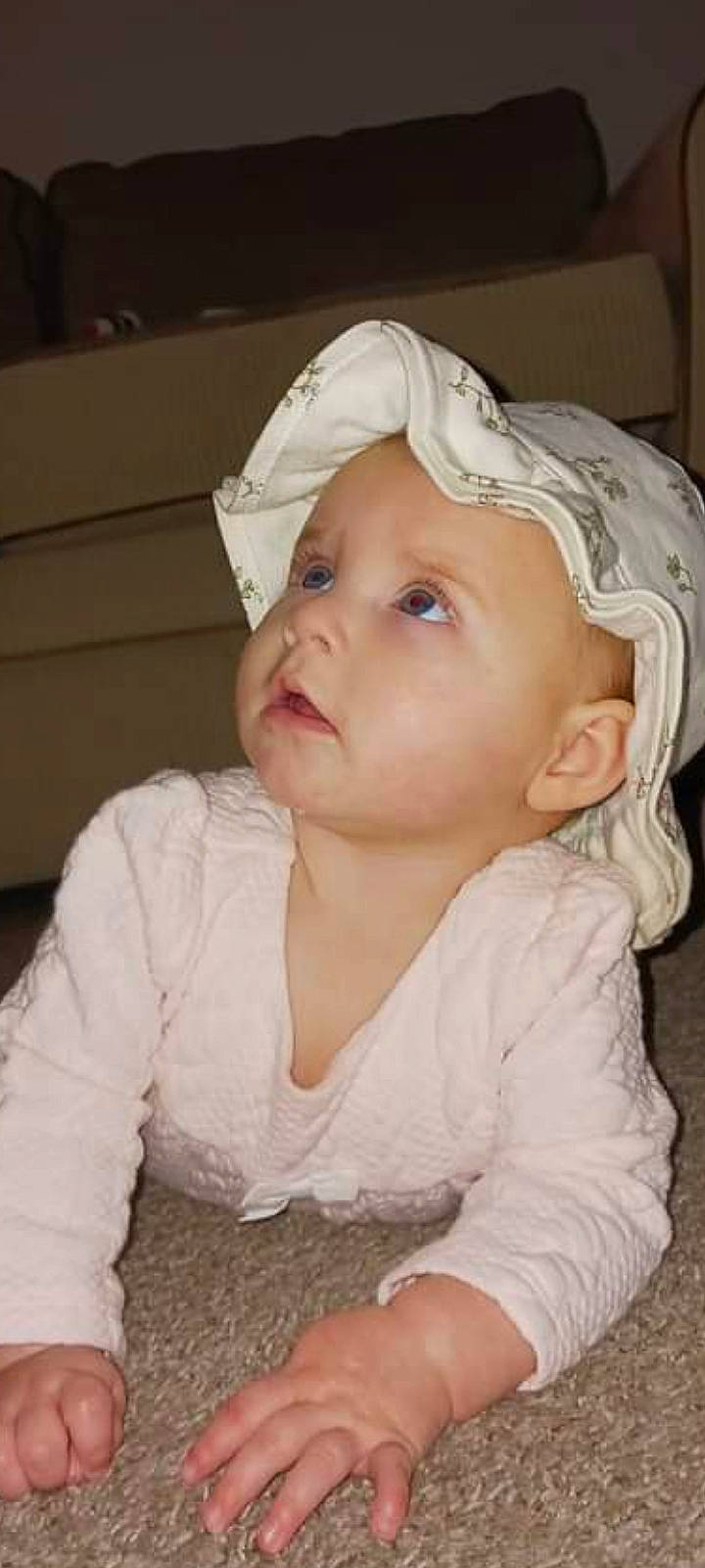 Hadley is registered to the contest to win money with this photo: baby, baby_toddler_clothing, cap, cheek, child, chin, clothing, ear, eye, eyebrow, facial_expression, hair_accessory, hat, headgear, headwear, iris, lip, nose, person, skin