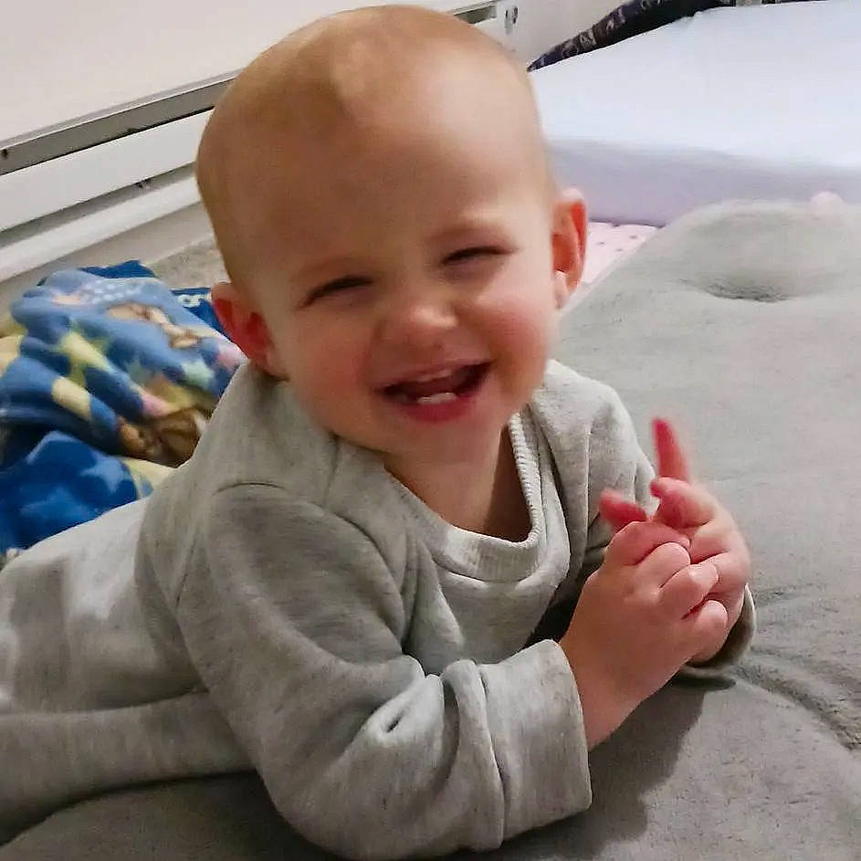 Aiden is registered to the contest to win money with this photo: baby, baby_laughing, baby_toddler_clothing, cheek, child, chin, comfort, finger, flooring, fun, gesture, happy, joy, laugh, person, product, sitting, skin, sleeve, smile